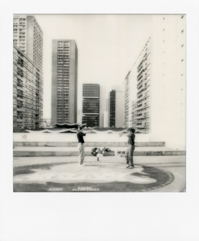 Black and white Polaroid of Paris. Two young women dance a hip-hop choreography on an esplanade in the Olympiades district, Paris, 17 March 2021. Photo by Virginie Merle / Hans Lucas. 
Deux jeunes femmes dansent un choregraphie de hip-hop sur une esplanade du quartier des Olympiades, Paris, le 17 Mars 2021. Photo de Virginie Merle / Hans Lucas.